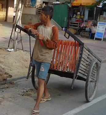 Young boy collecting trash